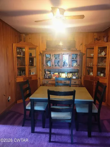 a room with a table chairs and a dining table