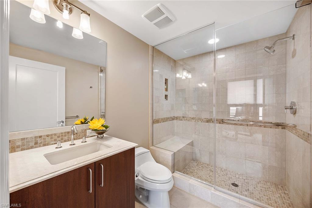 9115 Strada Place, Unit 5416 Naples, FL 34108 - Photo 19 of 44 Full bathroom featuring vanity, a shower stall, light tile patterned floors, and recessed lighting