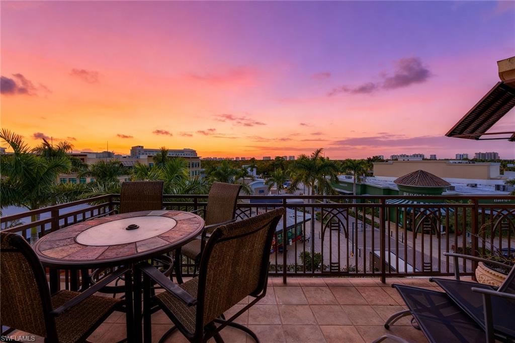 9115 Strada Place, Unit 5416 Naples, FL 34108 - Photo 27 of 44 View of patio terrace at dusk