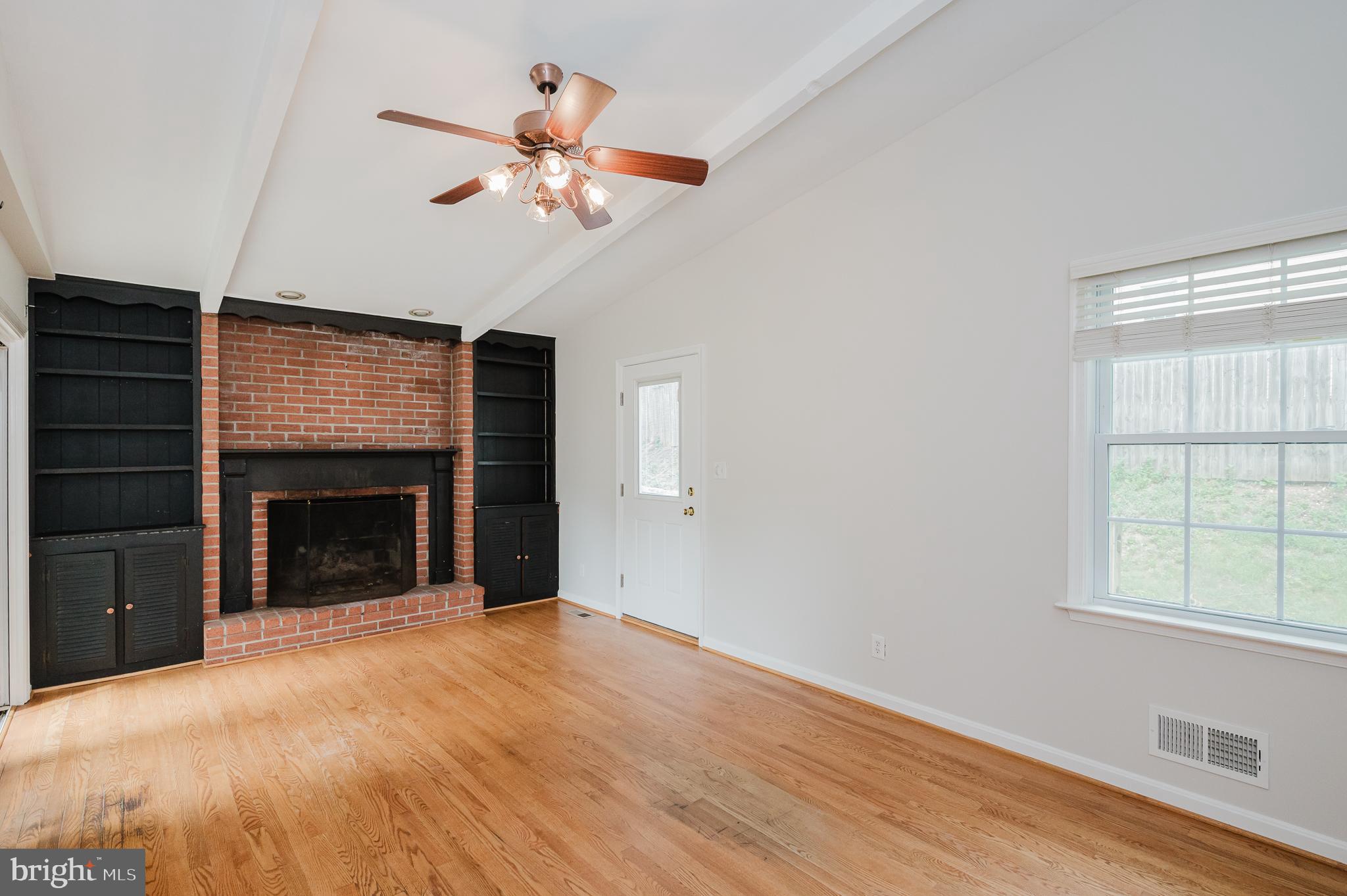 4 Old Spring Court Cockeysville, MD 21030 - Photo 18 of 53 a view of an empty room with a fireplace and a window