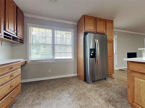 a kitchen with stainless steel appliances granite countertop a stove and a refrigerator