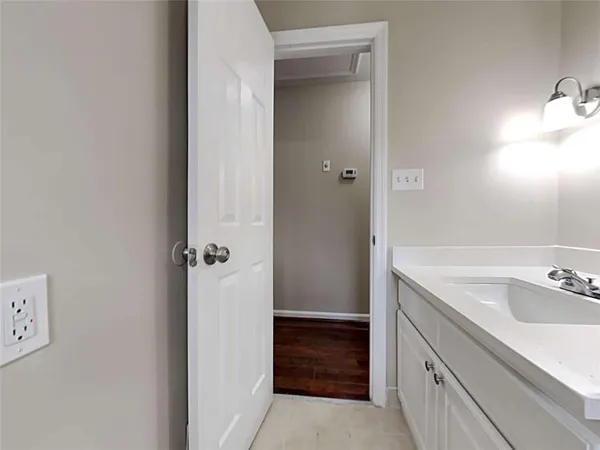a bathroom with a sink and mirror