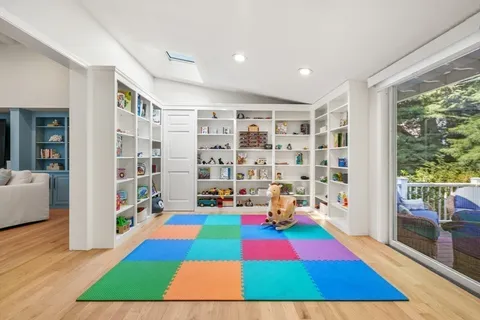 a room with furniture and large rug