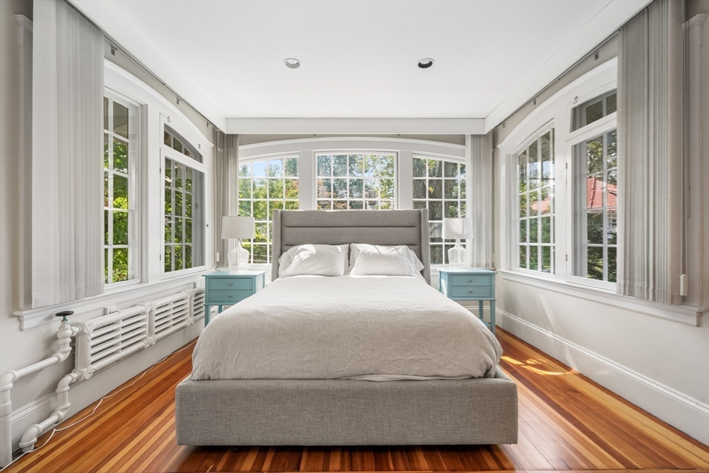 85 Williston Road Brookline, MA 02445 - Photo 15 of 29 a large bedroom with a bed and glass window