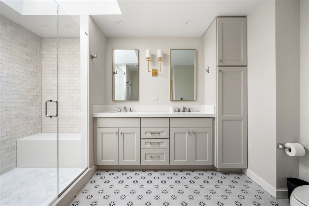 85 Williston Road Brookline, MA 02445 - Photo 18 of 29 a bathroom with a sink a toilet and shower