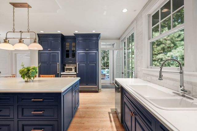 a spacious bathroom with a granite countertop sink and a mirror