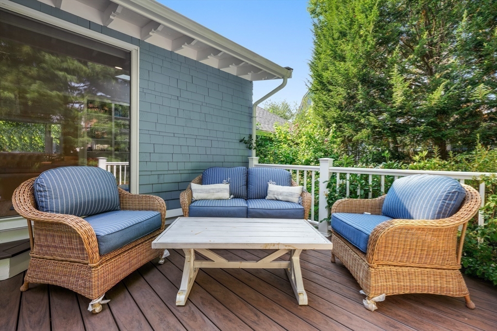 85 Williston Road Brookline, MA 02445 - Photo 22 of 29 a roof deck with a couch and chairs