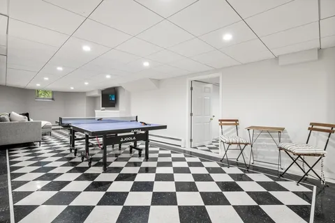 a room with a black white checkered floor with a black white checkered floor