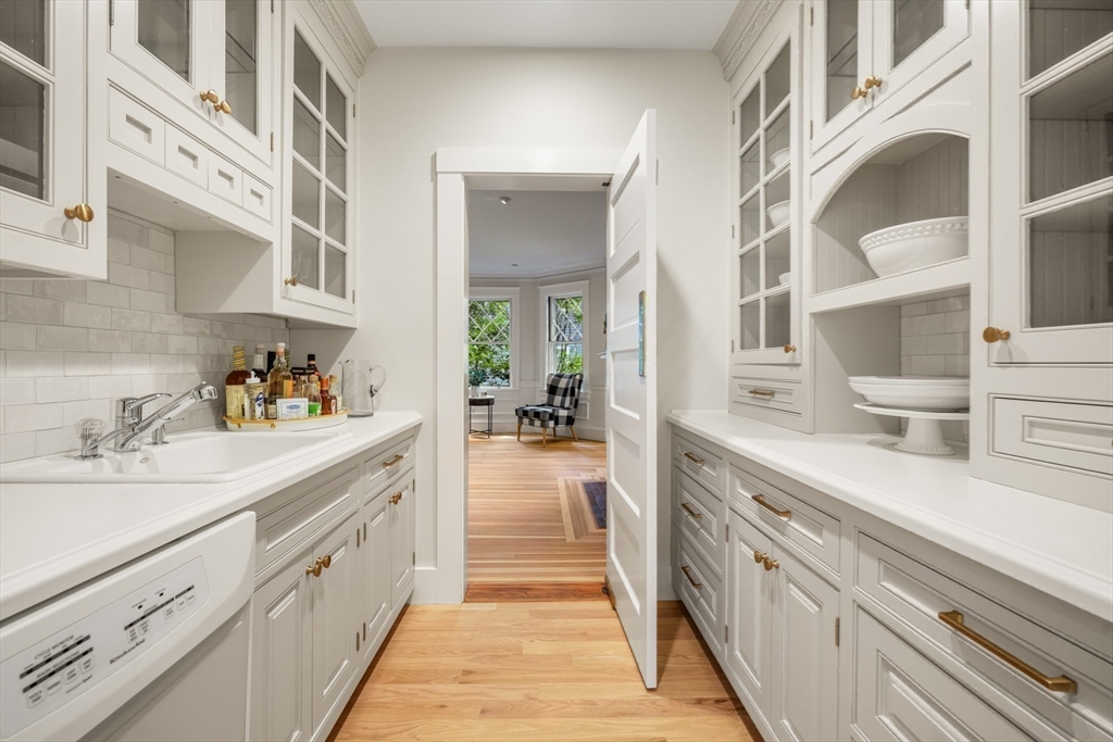 85 Williston Road Brookline, MA 02445 - Photo 9 of 29 a spacious en suite bathroom with a double vanity sink and mirror