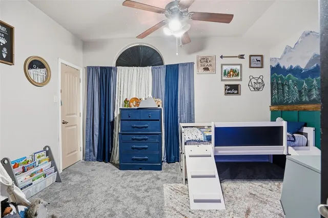 a living room with furniture and a mirror