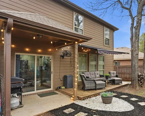 a patio with table and chairs