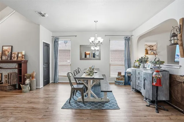 a work room with furniture and wooden floor