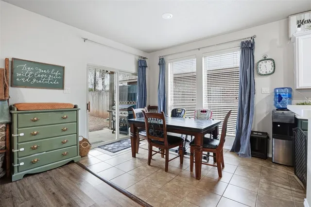 a view of a dining room with furniture and window