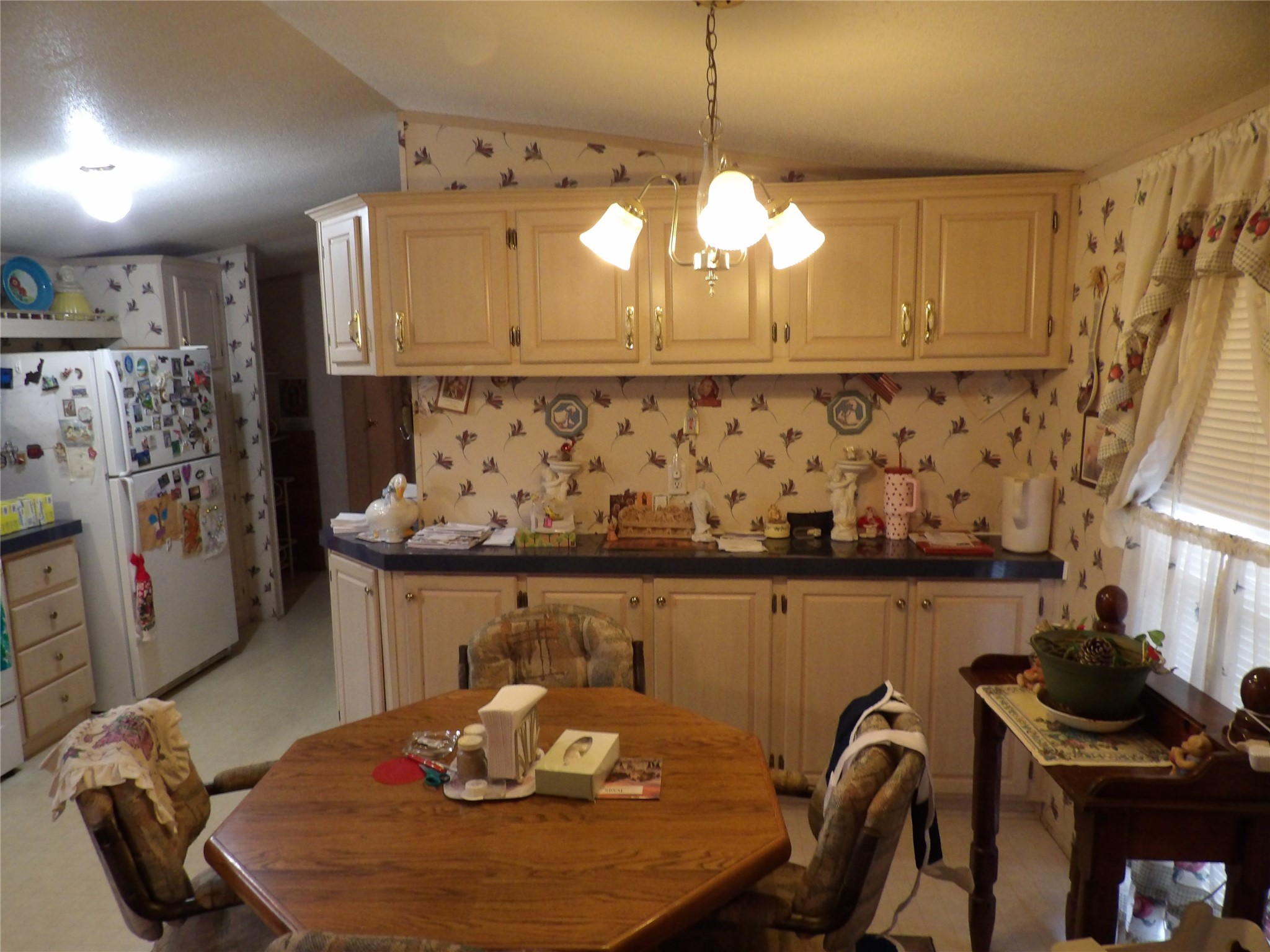 4748 County Road 3220 Kempner, TX 76539 - Photo 2 of 17 a kitchen with stainless steel appliances a table chairs in it and wooden floor