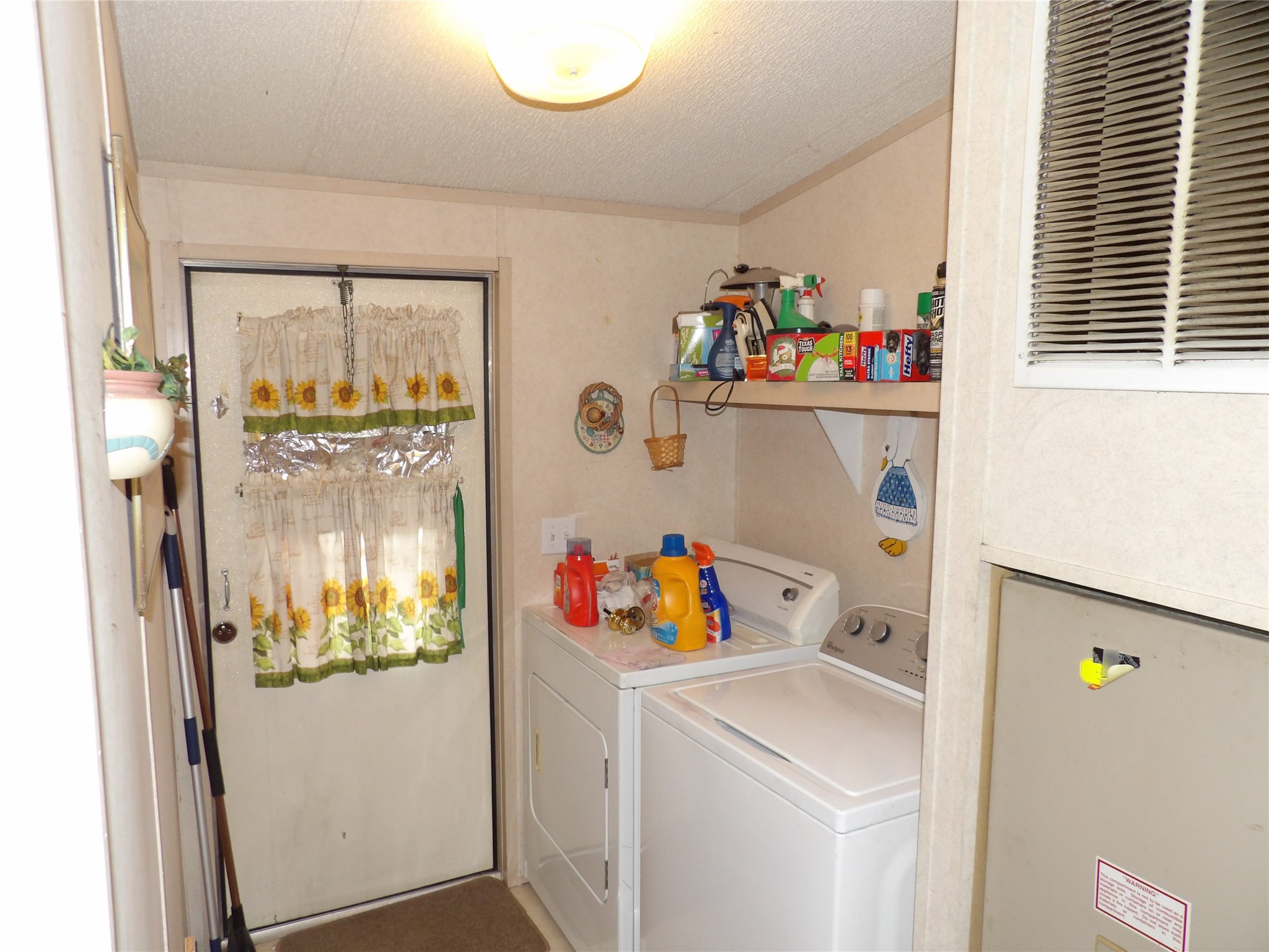 4748 County Road 3220 Kempner, TX 76539 - Photo 5 of 17 a storage room with a fridge and washer
