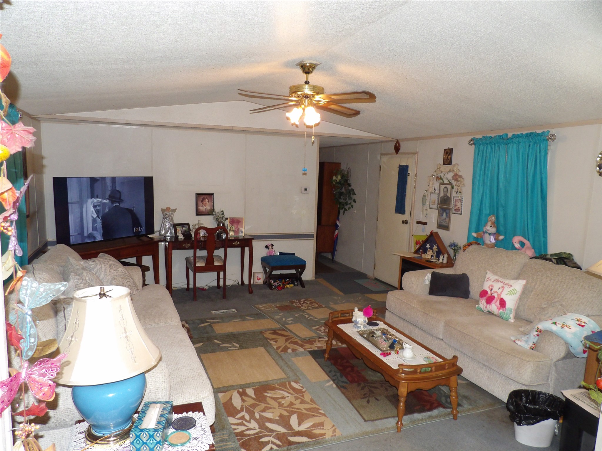 4748 County Road 3220 Kempner, TX 76539 - Photo 9 of 17 a living room with furniture a chandelier and a piano