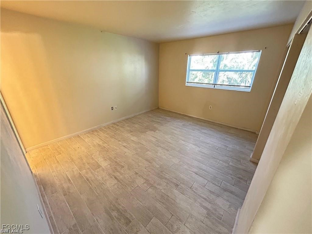2828 Jackson Street, Unit C7 Fort Myers, FL 33901 - Photo 7 of 14 a view of empty room with windows