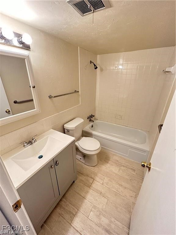 2828 Jackson Street, Unit C7 Fort Myers, FL 33901 - Photo 8 of 14 a bathroom with a sink a toilet and shower