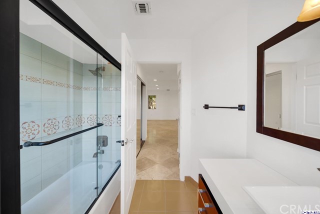 2026 Rimcrest Drive Glendale, CA 91207 - Photo 11 of 44 a bathroom with a bathtub and a shower