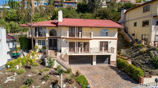 2026 Rimcrest Drive Glendale, CA 91207 - Photo 2 of 44 a front view of a house with garden