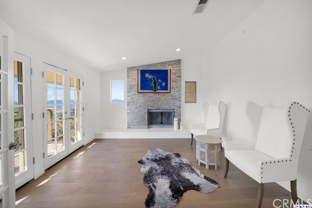 2026 Rimcrest Drive Glendale, CA 91207 - Photo 22 of 44 a living room with furniture and a fireplace