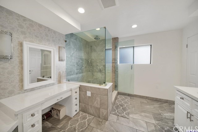 2026 Rimcrest Drive Glendale, CA 91207 - Photo 25 of 44 a bathroom with a sink a toilet a mirror and shower