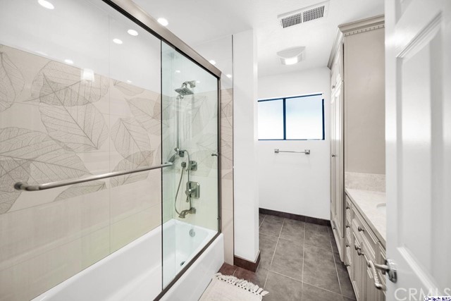 2026 Rimcrest Drive Glendale, CA 91207 - Photo 26 of 44 a bathroom with a bathtub and a shower