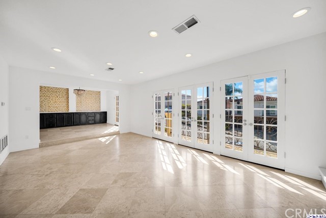2026 Rimcrest Drive Glendale, CA 91207 - Photo 33 of 44 a view of an empty room with wooden floor and windows
