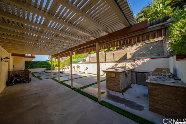 2026 Rimcrest Drive Glendale, CA 91207 - Photo 35 of 44 a roof deck with table and chairs