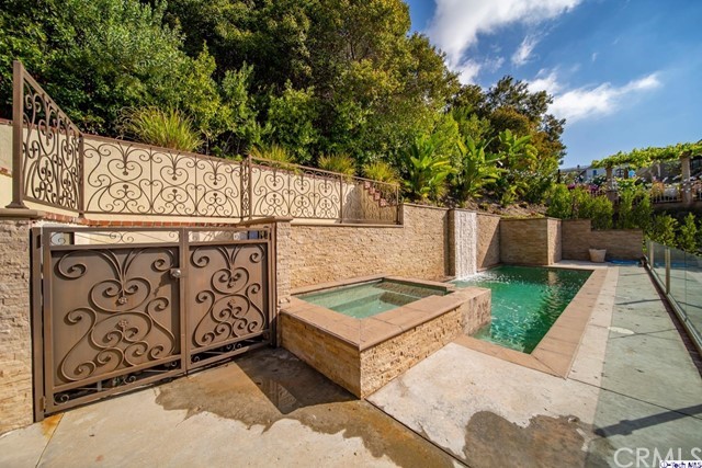 2026 Rimcrest Drive Glendale, CA 91207 - Photo 5 of 44 a view of a street sign under a large tree