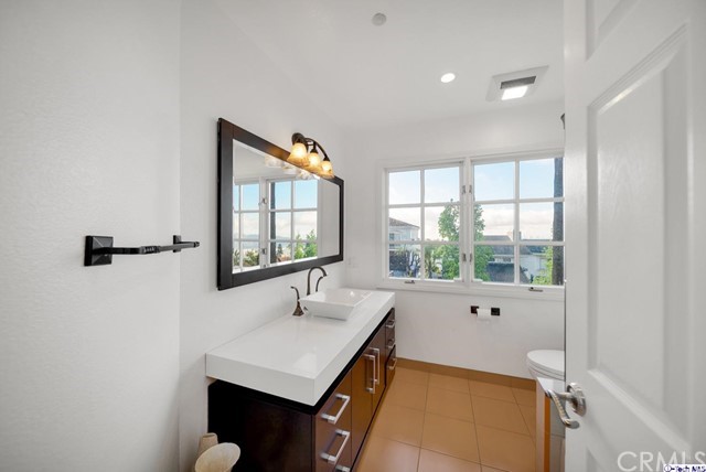 2026 Rimcrest Drive Glendale, CA 91207 - Photo 10 of 44 a bathroom with a sink and a bathtub