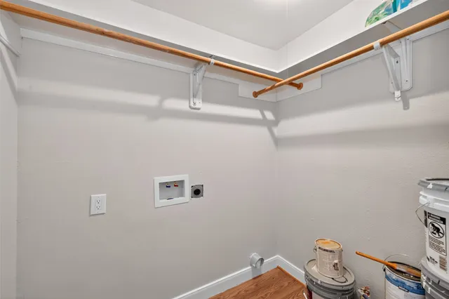 a view of a backyard with table and chairs under an umbrella