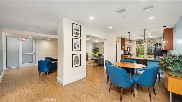 a dining room with furniture and a chandelier