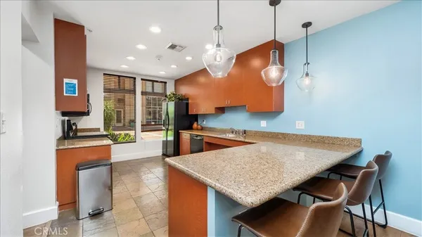 a kitchen with a table and chairs in it