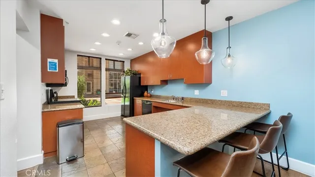 a kitchen with a table and chairs in it