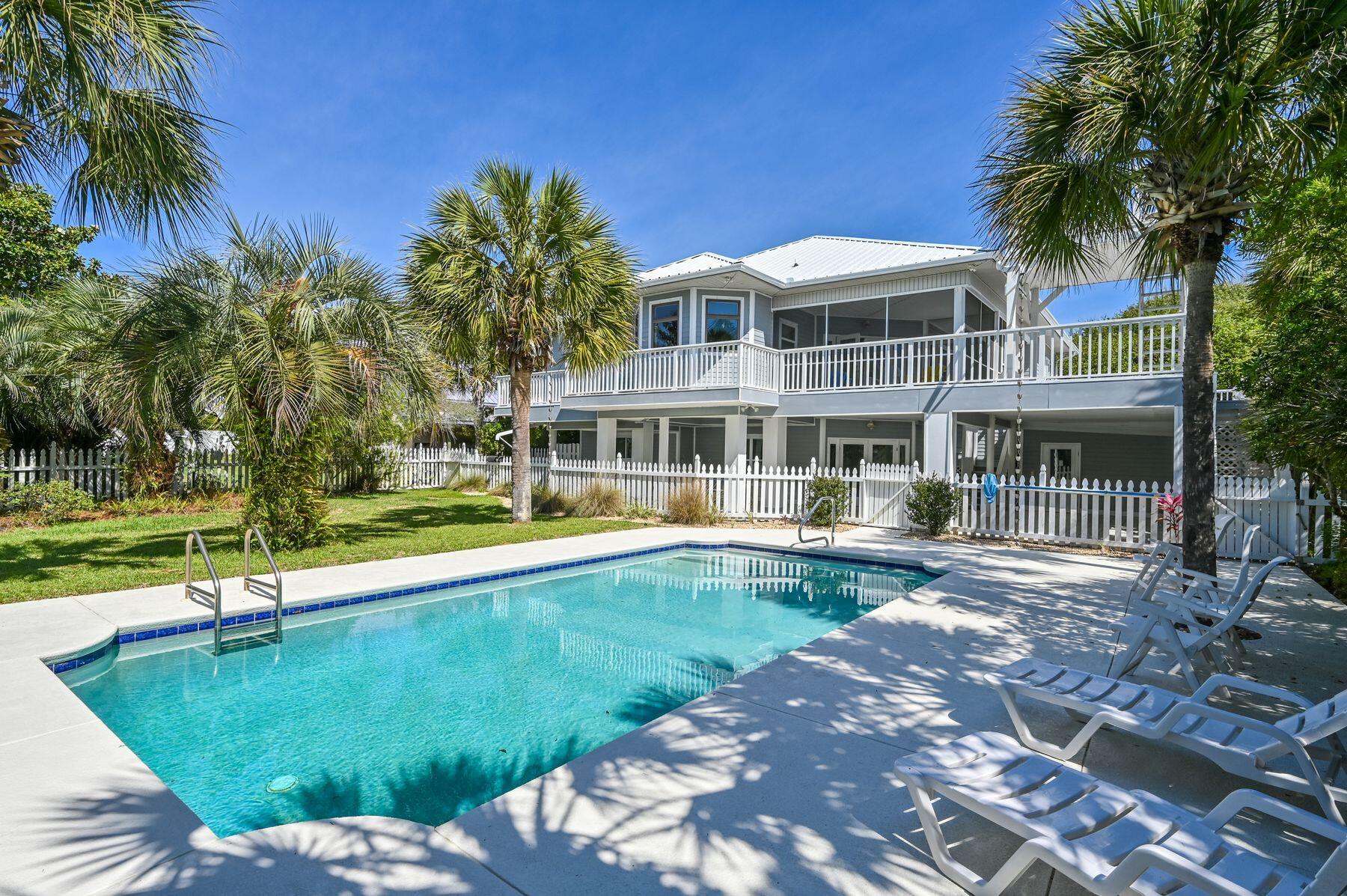 169 Pompano Street Inlet Beach, FL 32461 - Photo 1 of 49 a view of a house with swimming pool and a yard