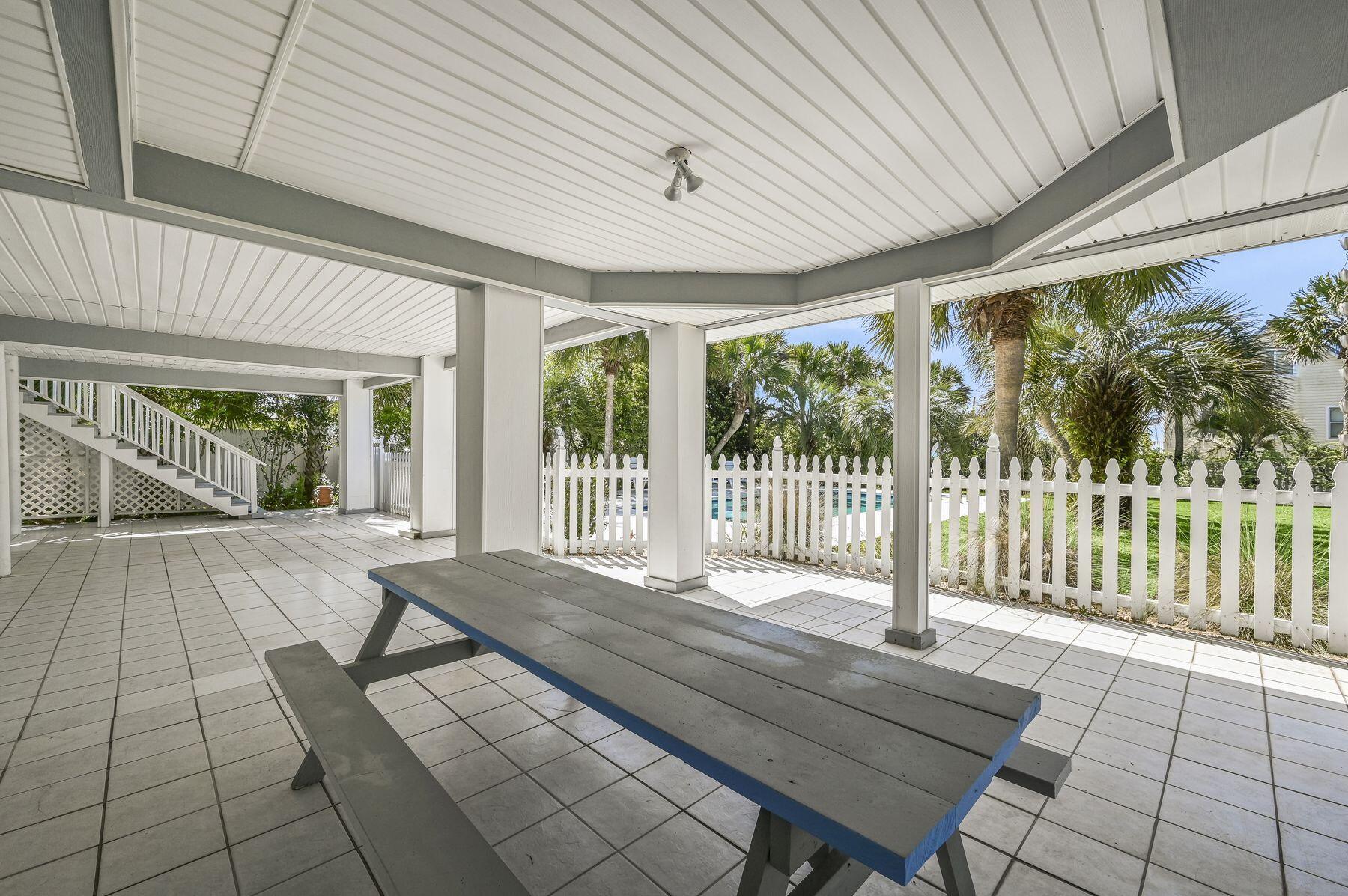 169 Pompano Street Inlet Beach, FL 32461 - Photo 12 of 49 a spacious bedroom with a large window and table