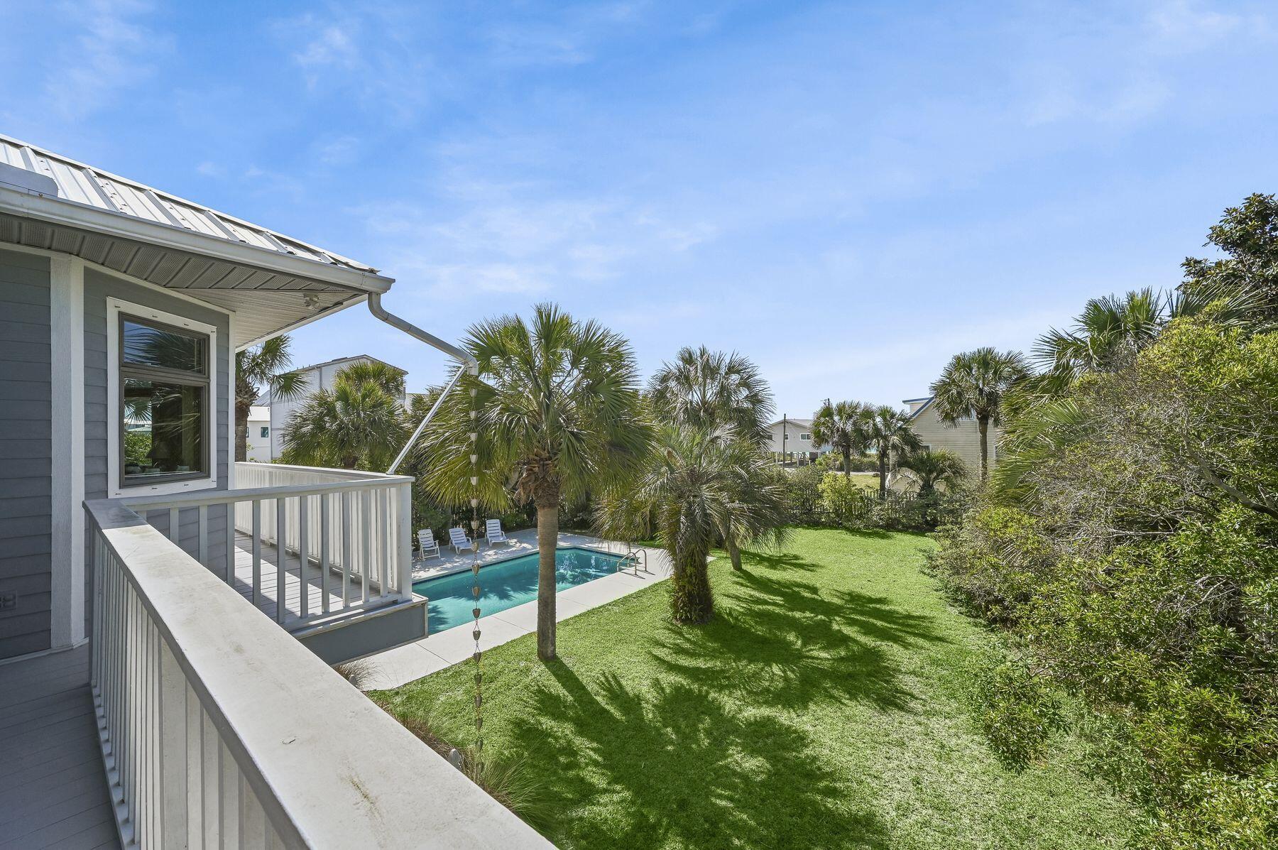 169 Pompano Street Inlet Beach, FL 32461 - Photo 13 of 49 a view of a wooden deck with a bench