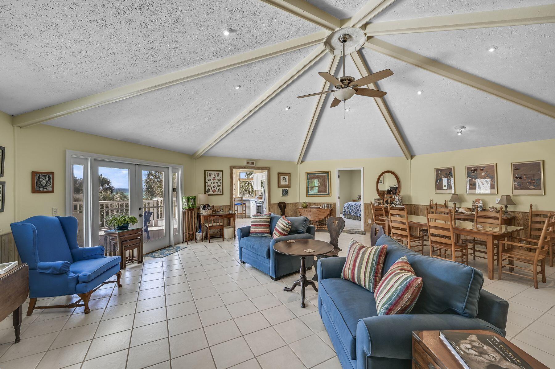 169 Pompano Street Inlet Beach, FL 32461 - Photo 18 of 49 a living room with lots of furniture and a chandelier