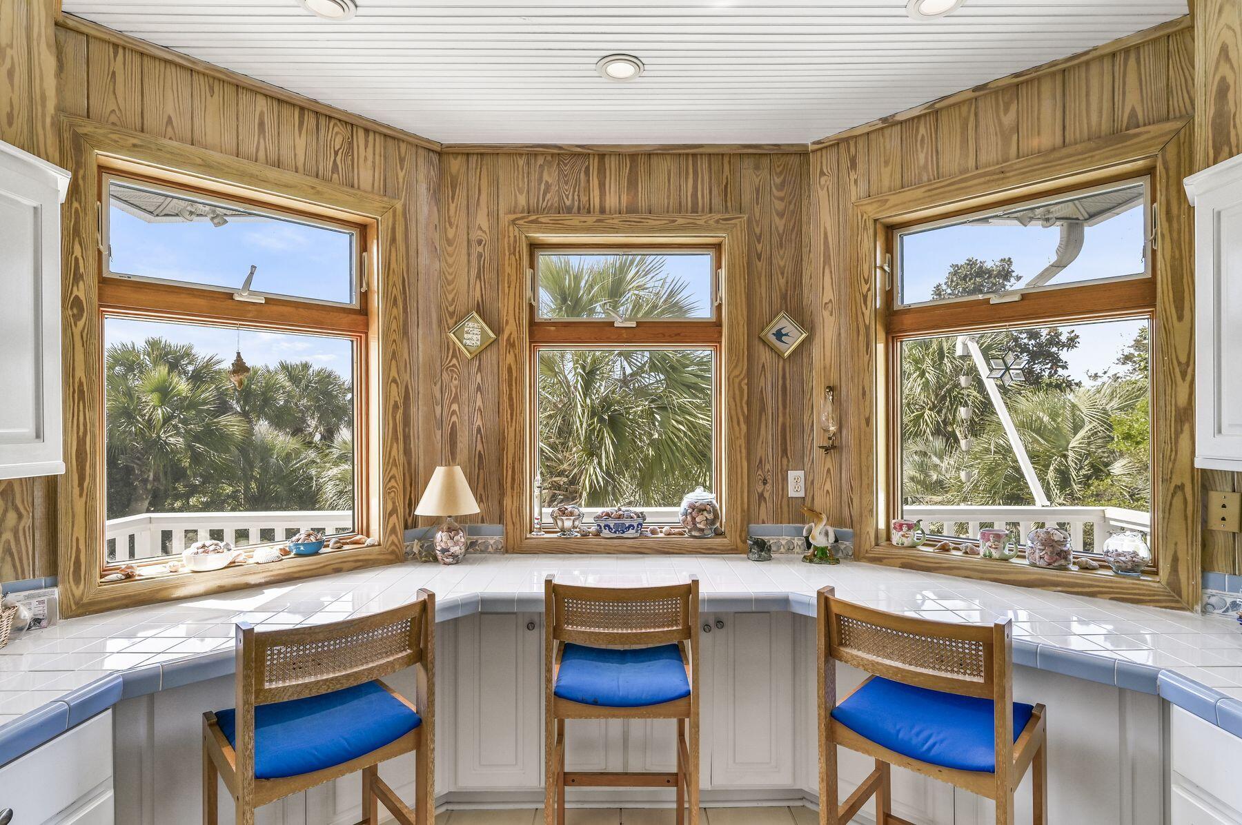 169 Pompano Street Inlet Beach, FL 32461 - Photo 21 of 49 a kitchen with a large window and a table