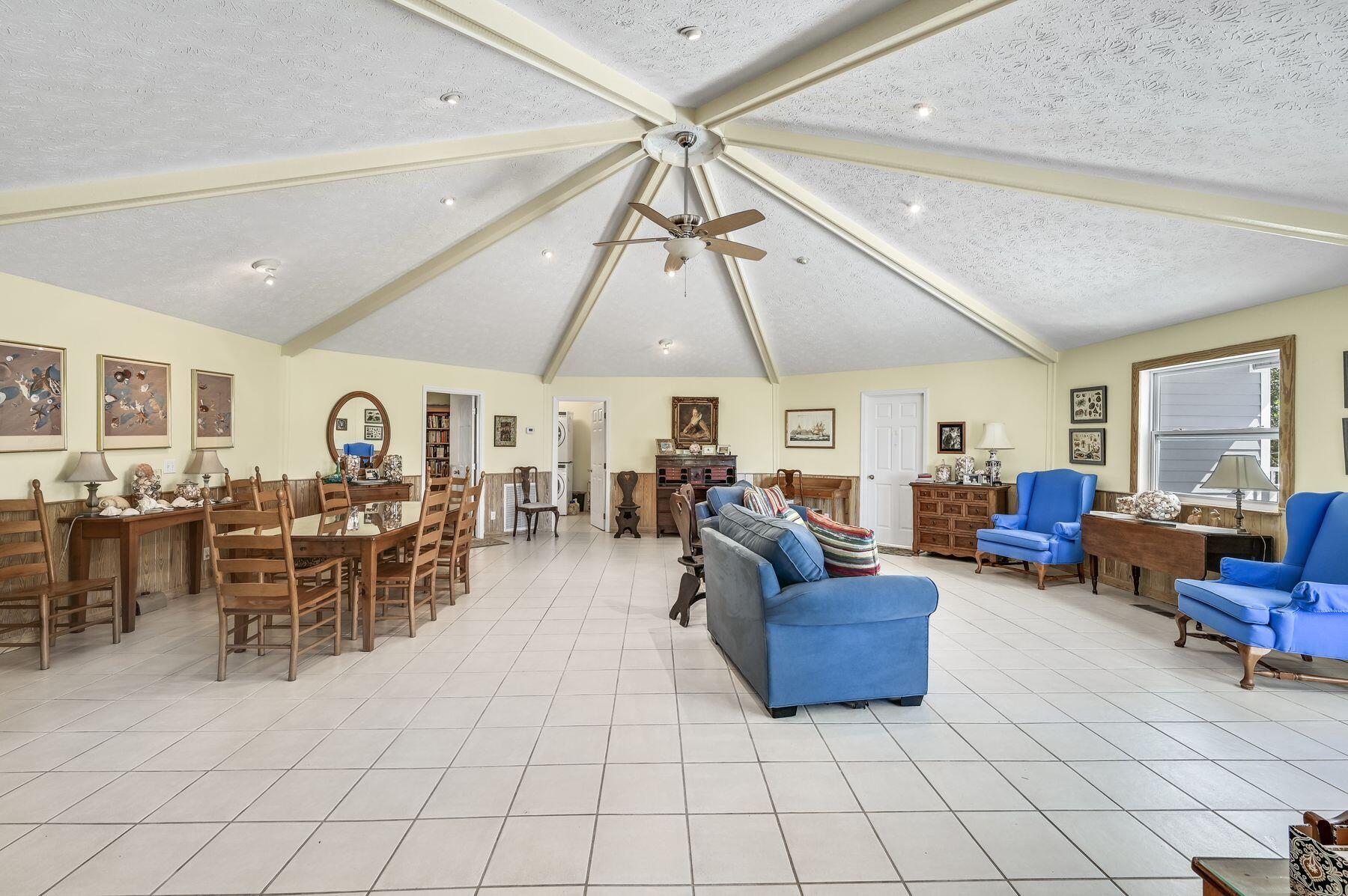 169 Pompano Street Inlet Beach, FL 32461 - Photo 22 of 49 a living room with lots of furniture and a chandelier