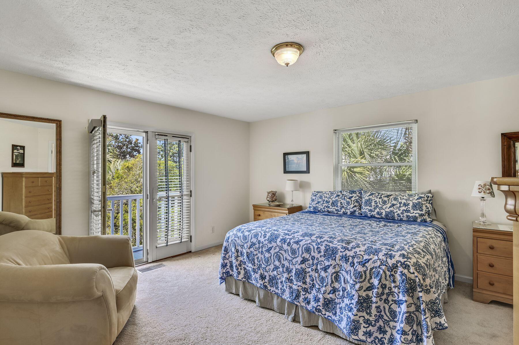 169 Pompano Street Inlet Beach, FL 32461 - Photo 23 of 49 a bedroom with a bed and a couch