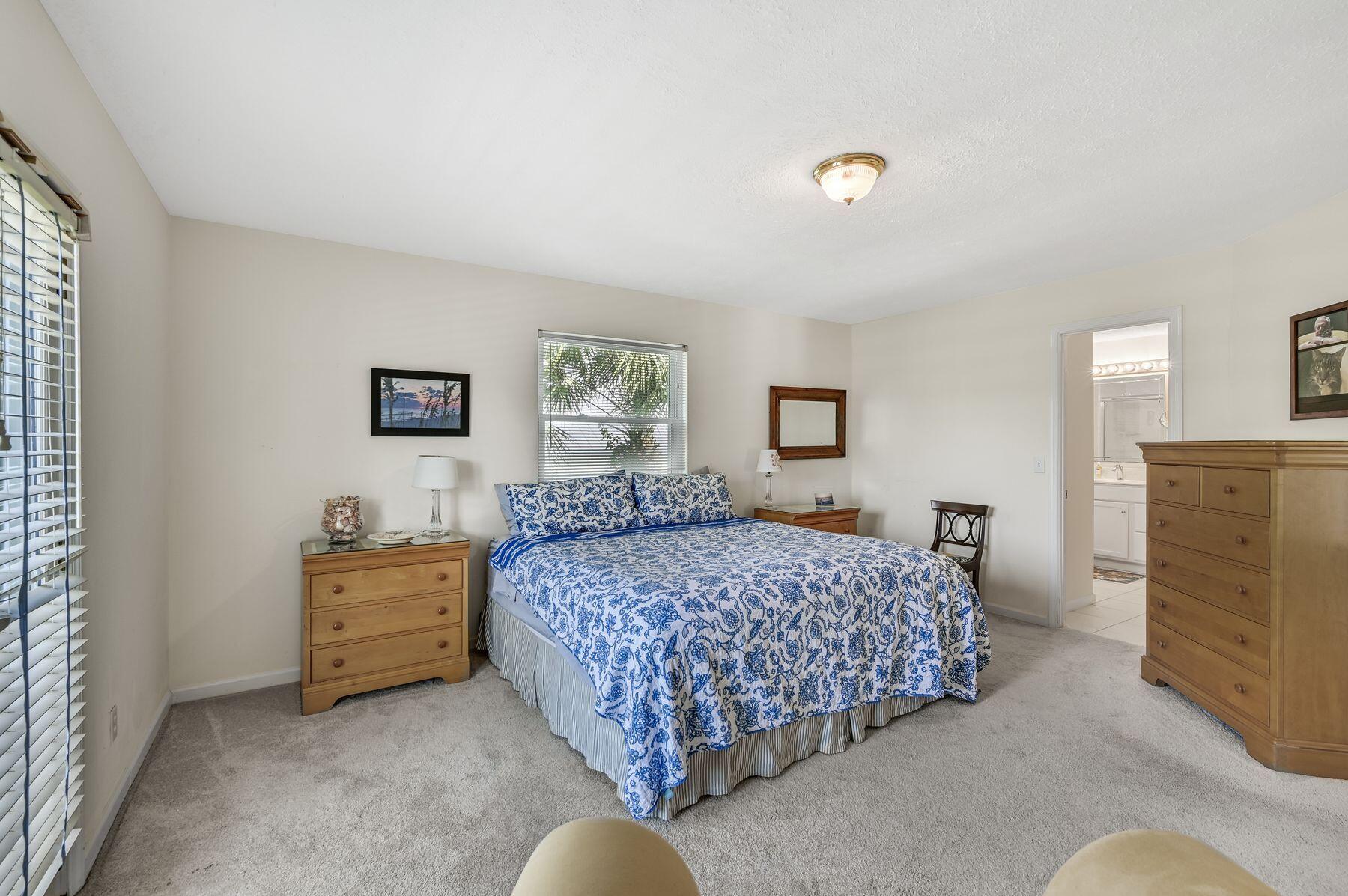 169 Pompano Street Inlet Beach, FL 32461 - Photo 25 of 49 a bedroom with a bed and dresser