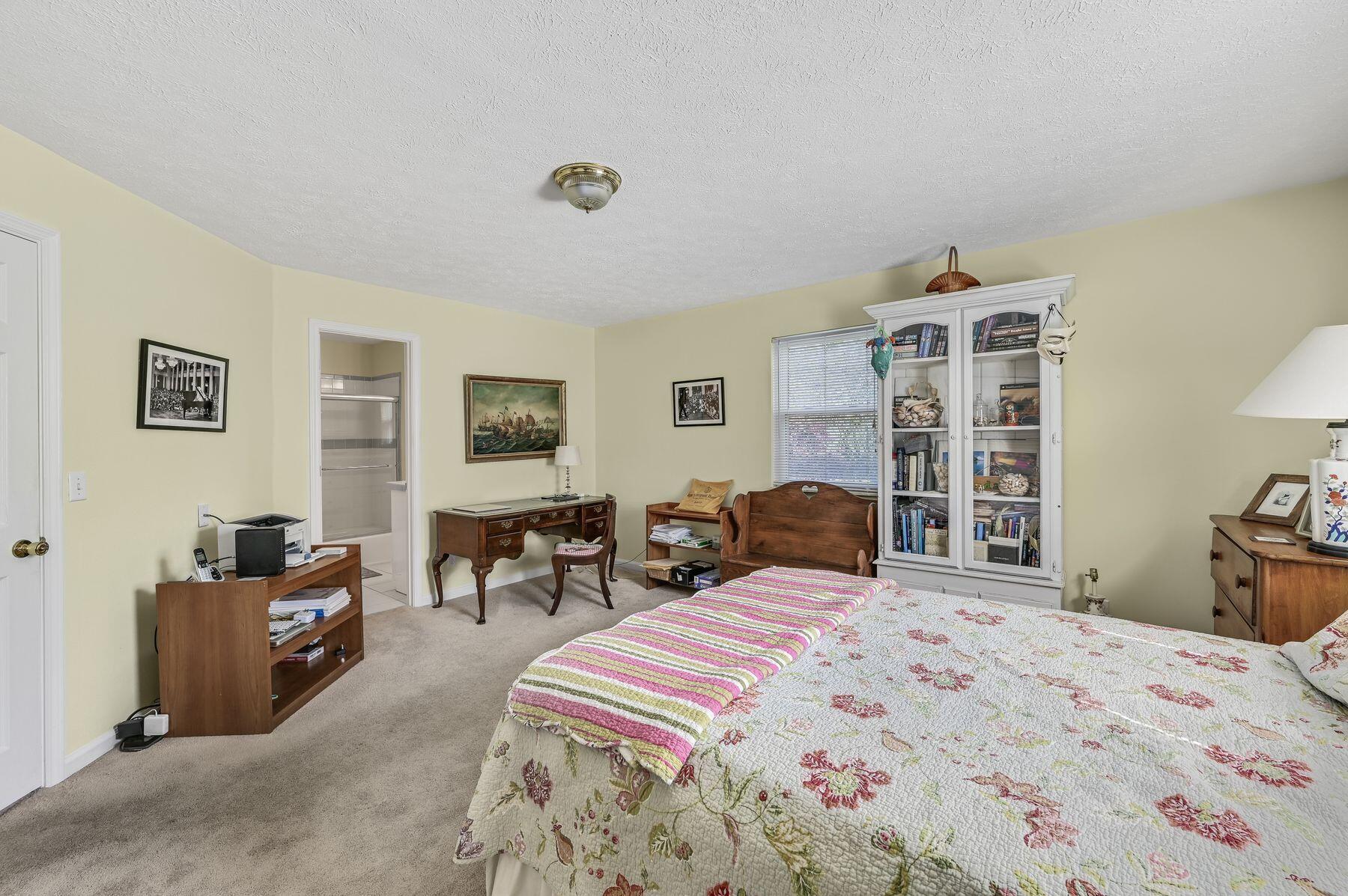 169 Pompano Street Inlet Beach, FL 32461 - Photo 28 of 49 a bedroom with a bed and wooden floor