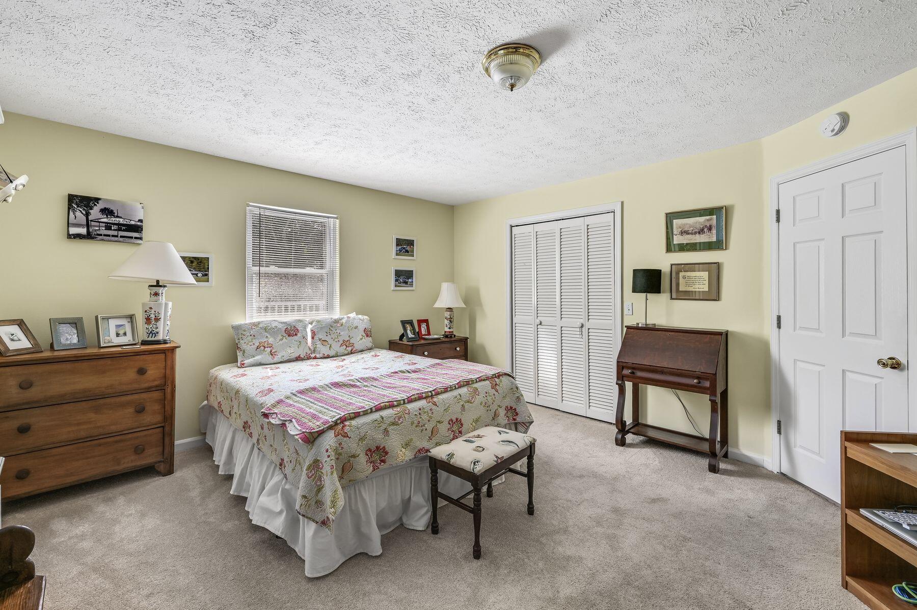 169 Pompano Street Inlet Beach, FL 32461 - Photo 29 of 49 a bedroom with a bed and a table in it