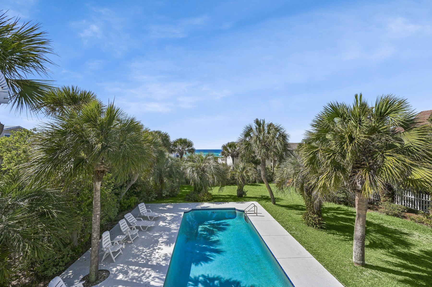 169 Pompano Street Inlet Beach, FL 32461 - Photo 35 of 49 a view of a yard with palm trees