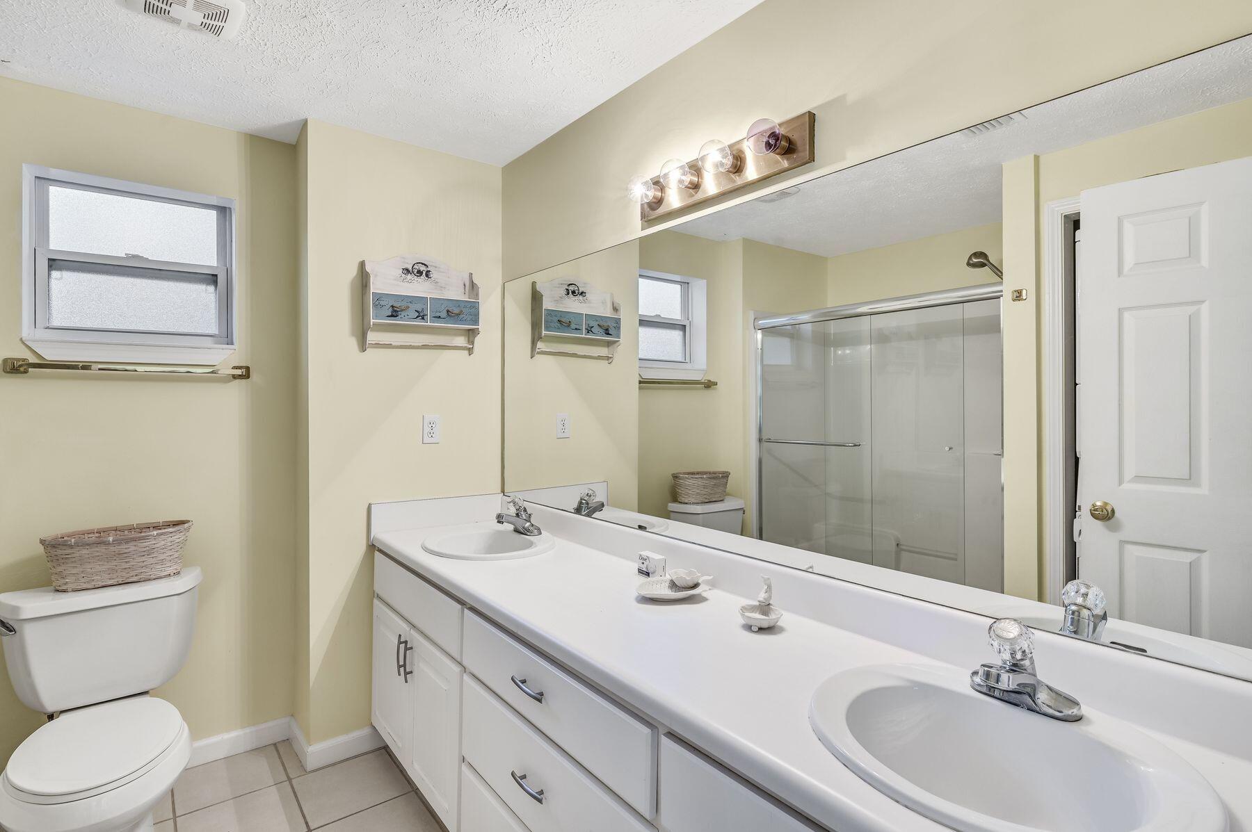 169 Pompano Street Inlet Beach, FL 32461 - Photo 42 of 49 a bathroom with a sink a toilet and shower