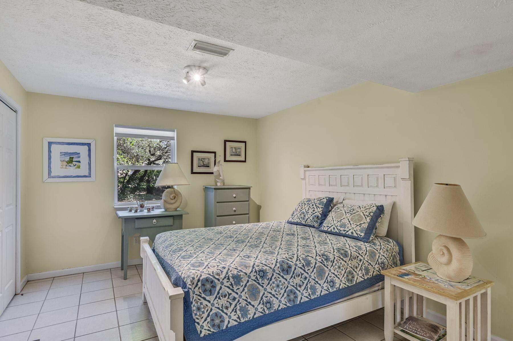 169 Pompano Street Inlet Beach, FL 32461 - Photo 43 of 49 a bedroom with a bed and dresser