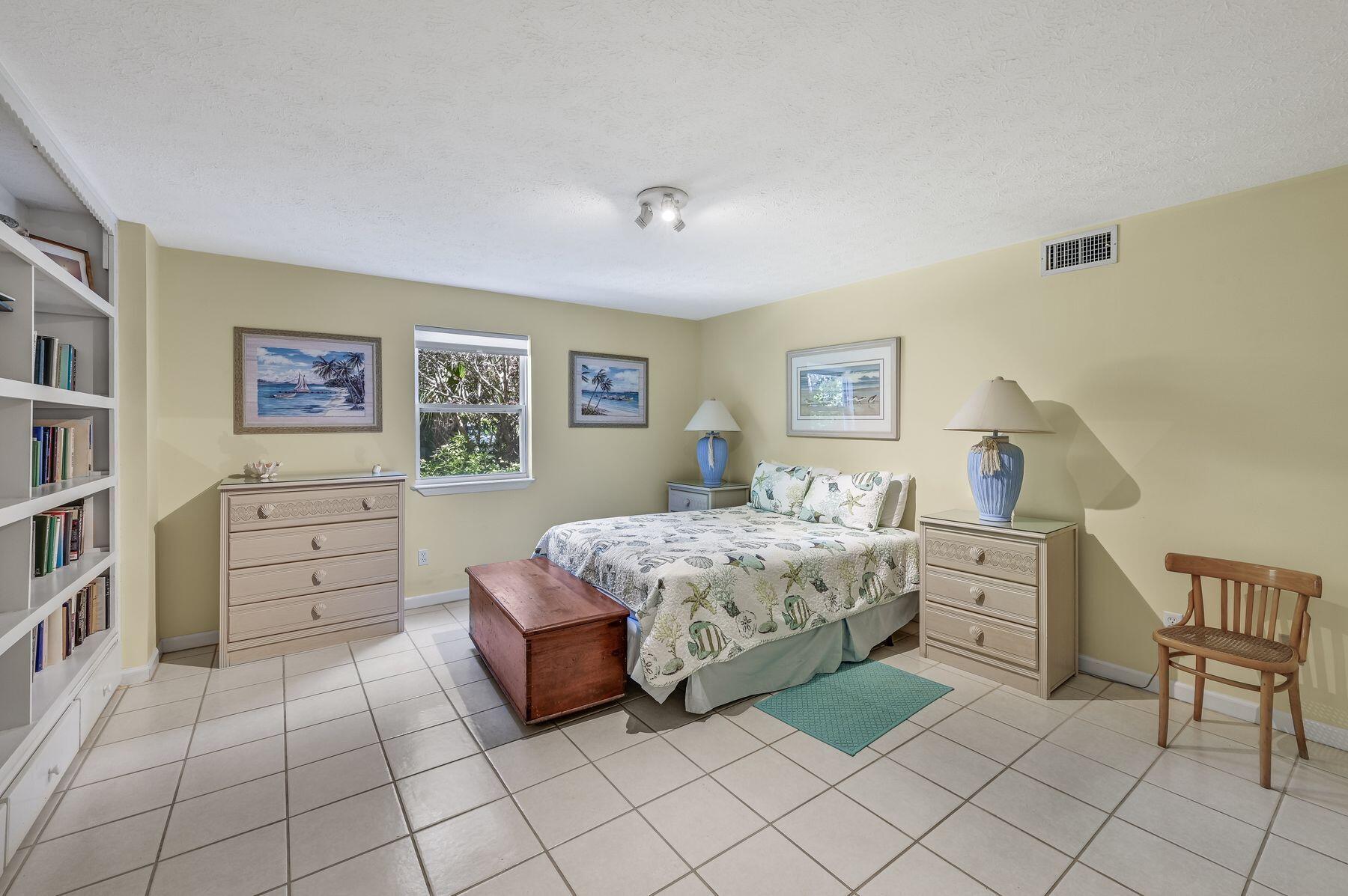 169 Pompano Street Inlet Beach, FL 32461 - Photo 45 of 49 a bedroom with a bed and furniture