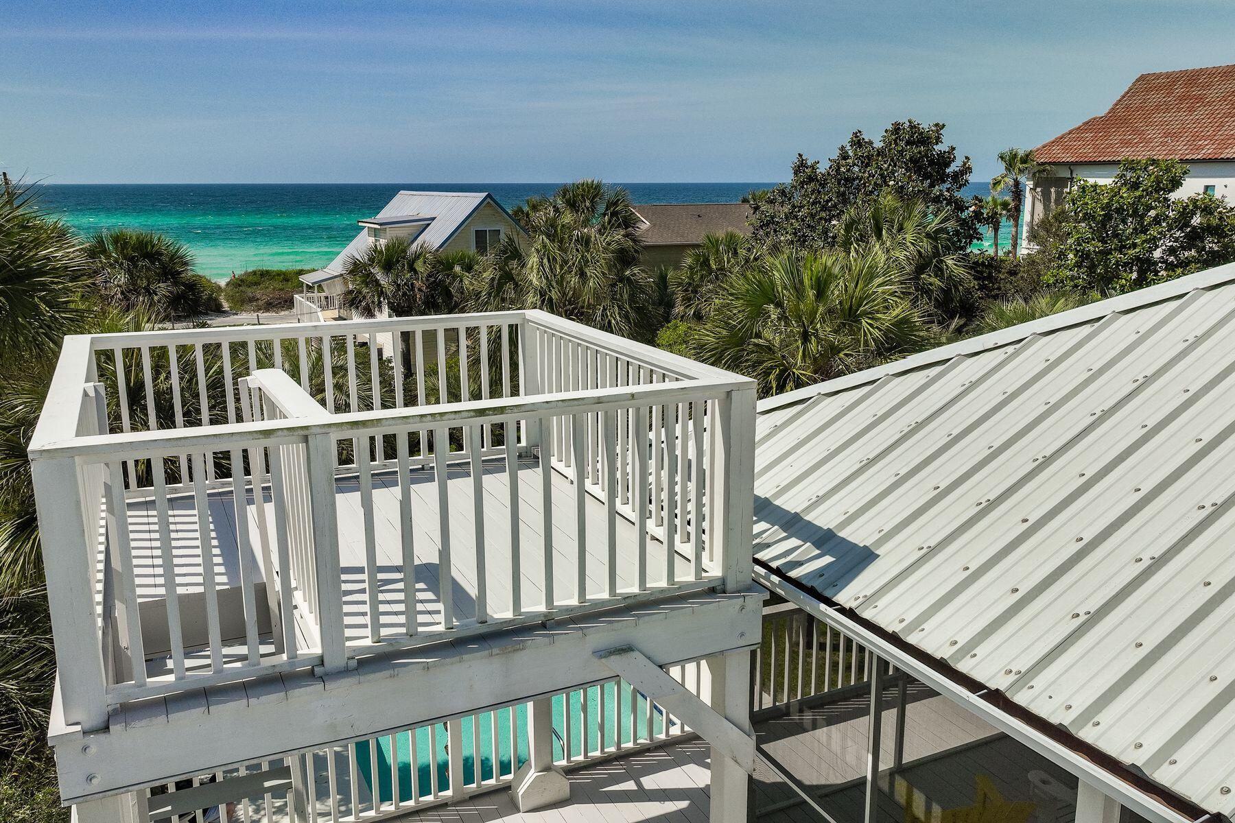 169 Pompano Street Inlet Beach, FL 32461 - Photo 10 of 49 a view of a balcony with wooden floor and fence